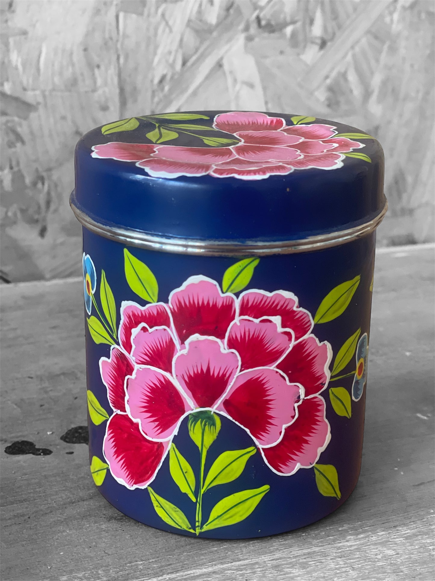 Blue tin with pink flower